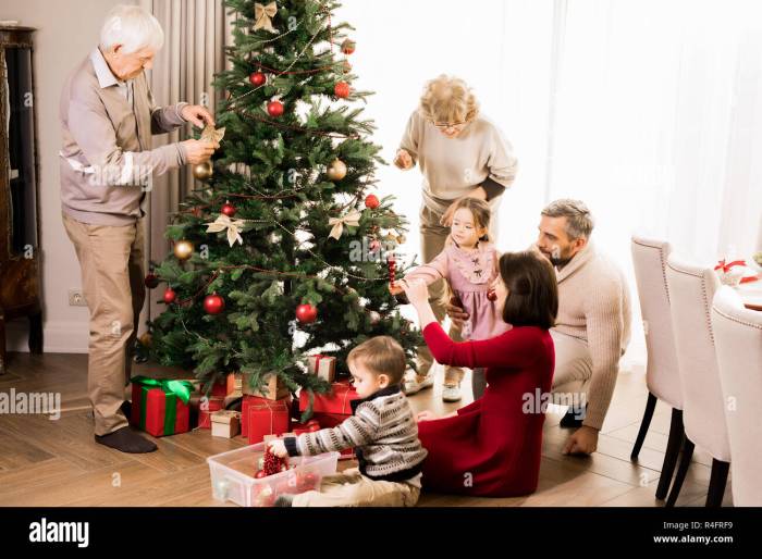 Christmas decorating tree family smiling people stock